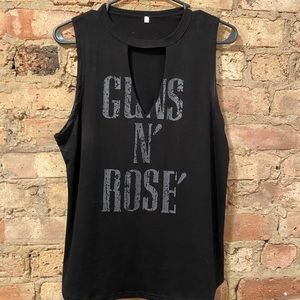 Guns and rosé tank top
